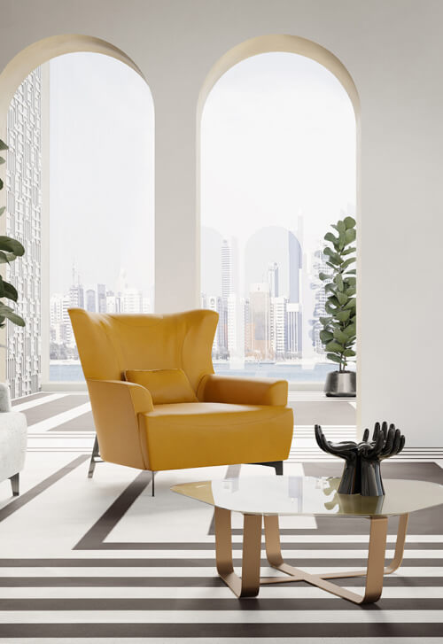 Borzalino Harmony armchair – mustard leather armchair in a bright room with arched windows