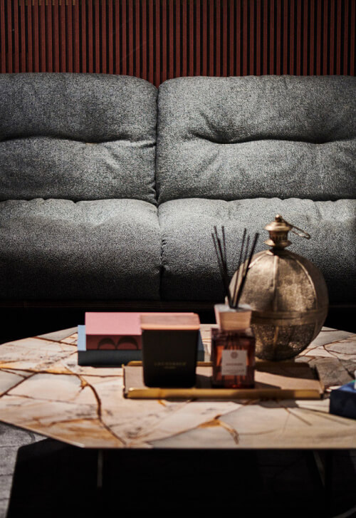 Borzalino Alex coffee table – marble top styled in front of a grey sofa