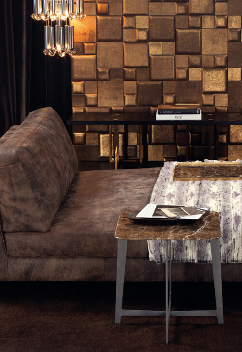 Borzalino marble-top table with grey metal legs beside a brown sofa